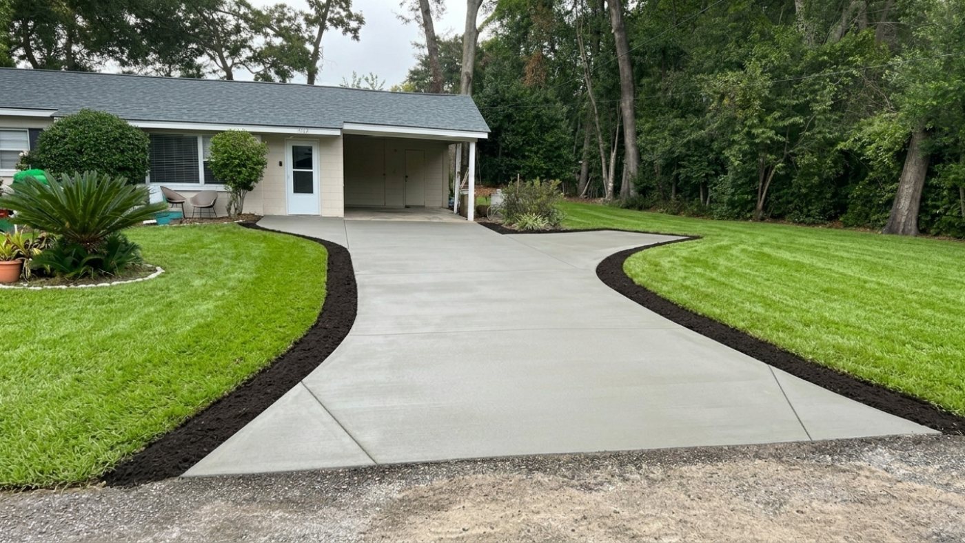Finished concrete driveway replacement at a single-story home in Charleston, SC