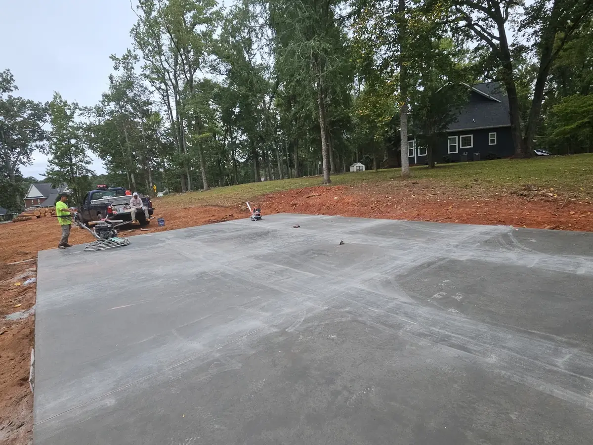 Power trowel putting a burnout finish on a 30 by 40 concrete slab for a metal boat storage building in Chapin, SC — Precision Palmetto
