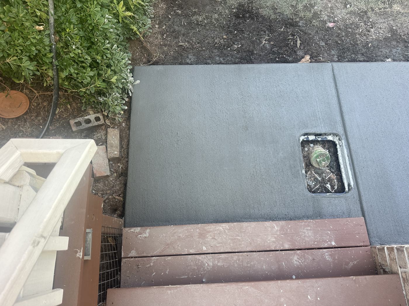 Fresh walkway pour, boxed out around the water meter — Precision Palmetto, Columbia SC