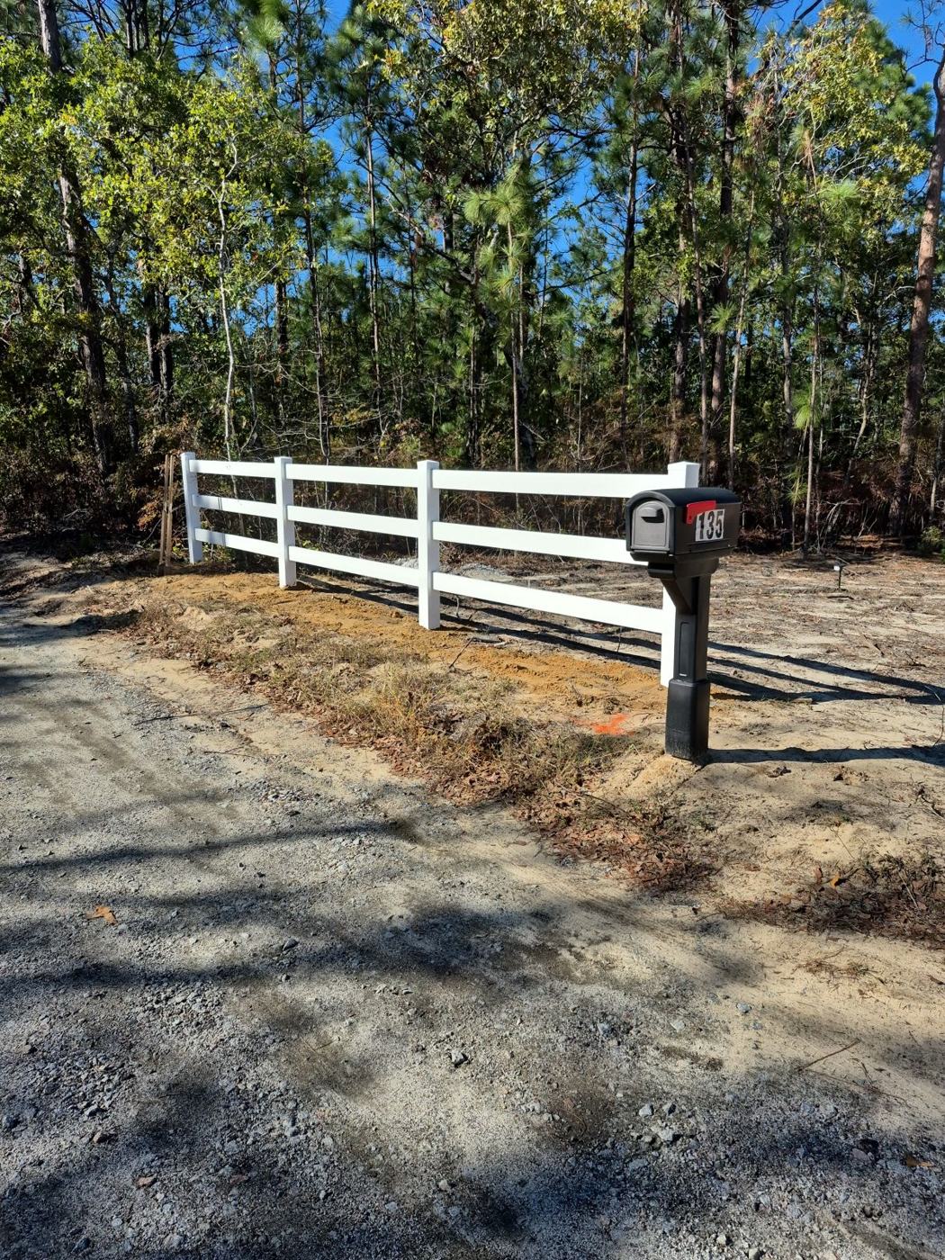 Vinyl rail fence with new mailbox post at the drive — Precision Palmetto, Columbia SC