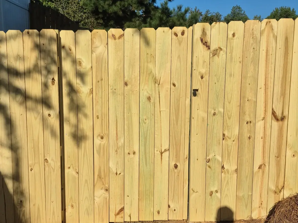 New wood privacy fence section and gate with a minimalist knob in Lexington, SC — Precision Palmetto