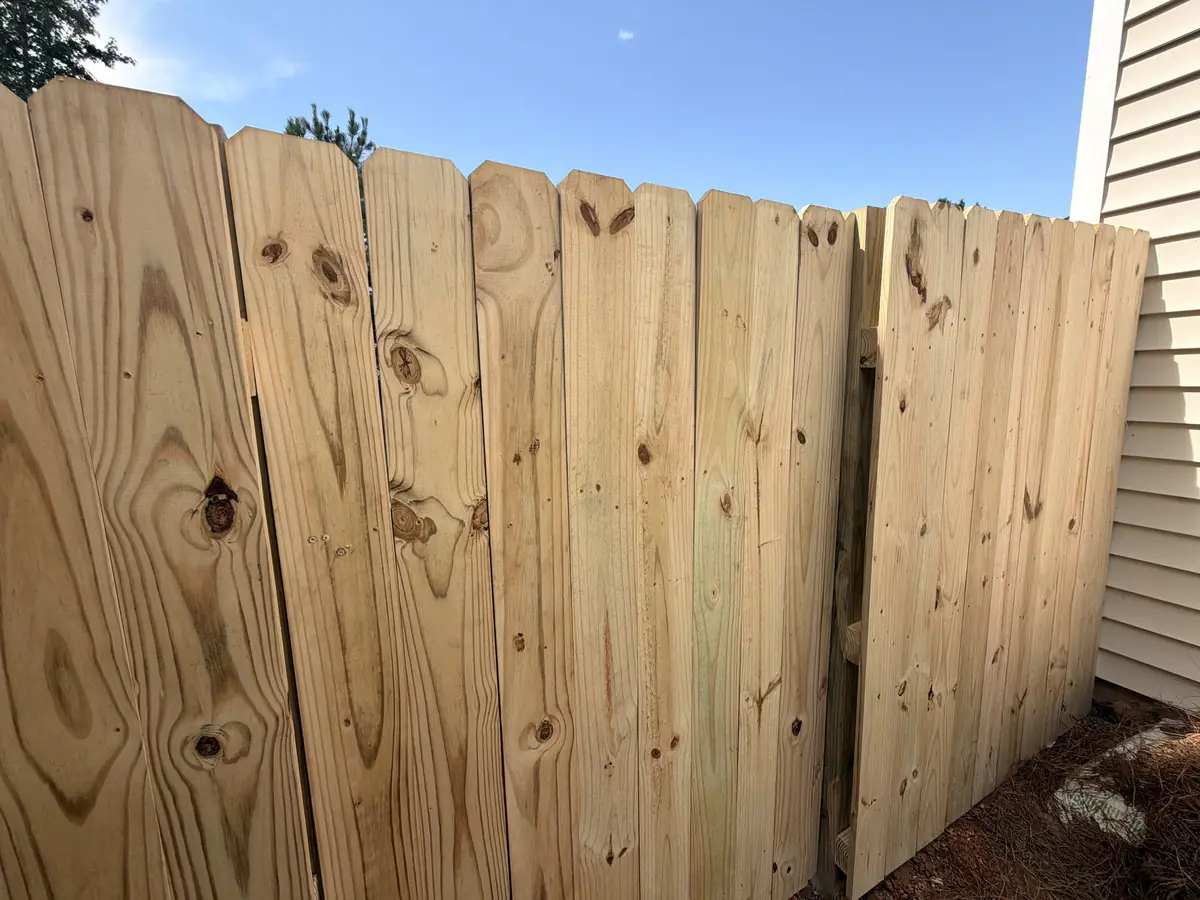 New wood privacy fence and gate meeting the house in Lexington, SC — Precision Palmetto