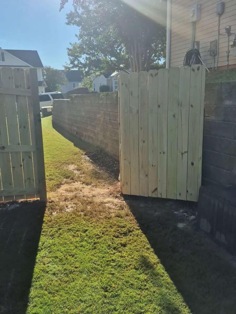New wood gate swung open to the side yard in Lexington, SC — Precision Palmetto