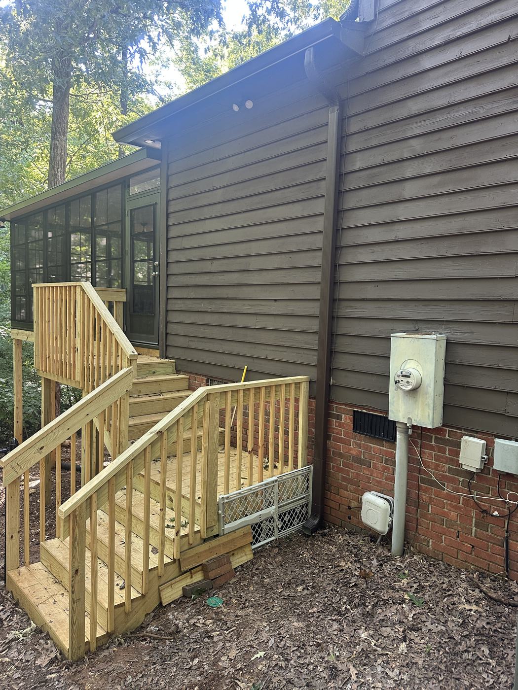 Downspout tied in, color-matched to the siding — Precision Palmetto, Columbia SC