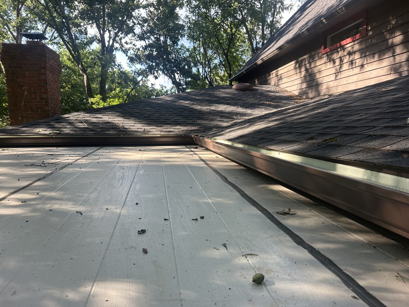 6-inch seamless gutters in brown, color-matched to the siding — Precision Palmetto, Columbia SC