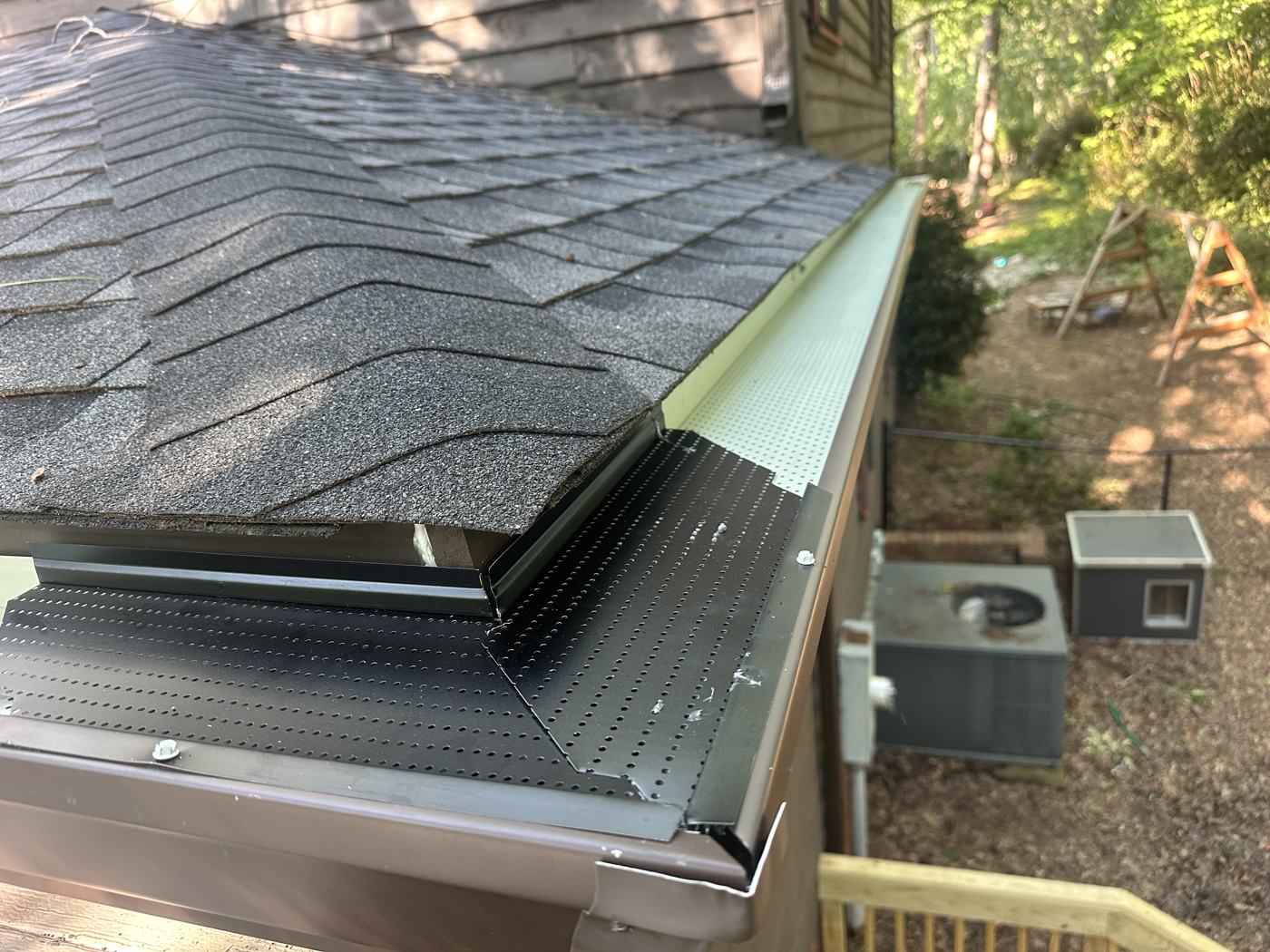 Gutter guard detail at the corner — fitted tight, screwed down — Precision Palmetto, Columbia SC