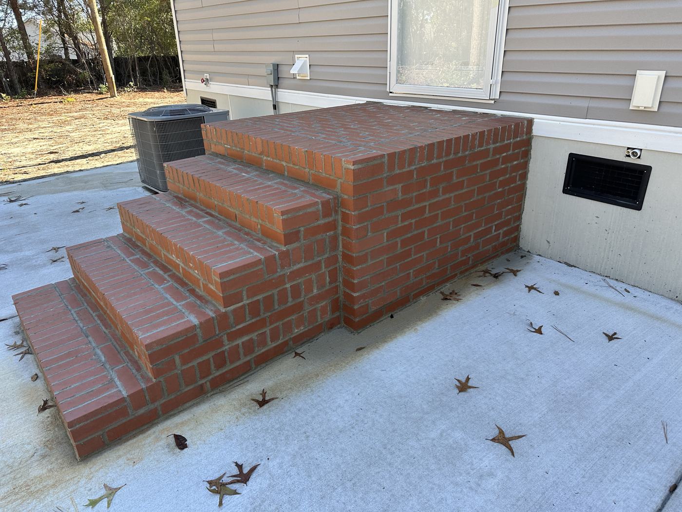 Brick steps and stoop laid on a fresh slab — Precision Palmetto, Columbia SC
