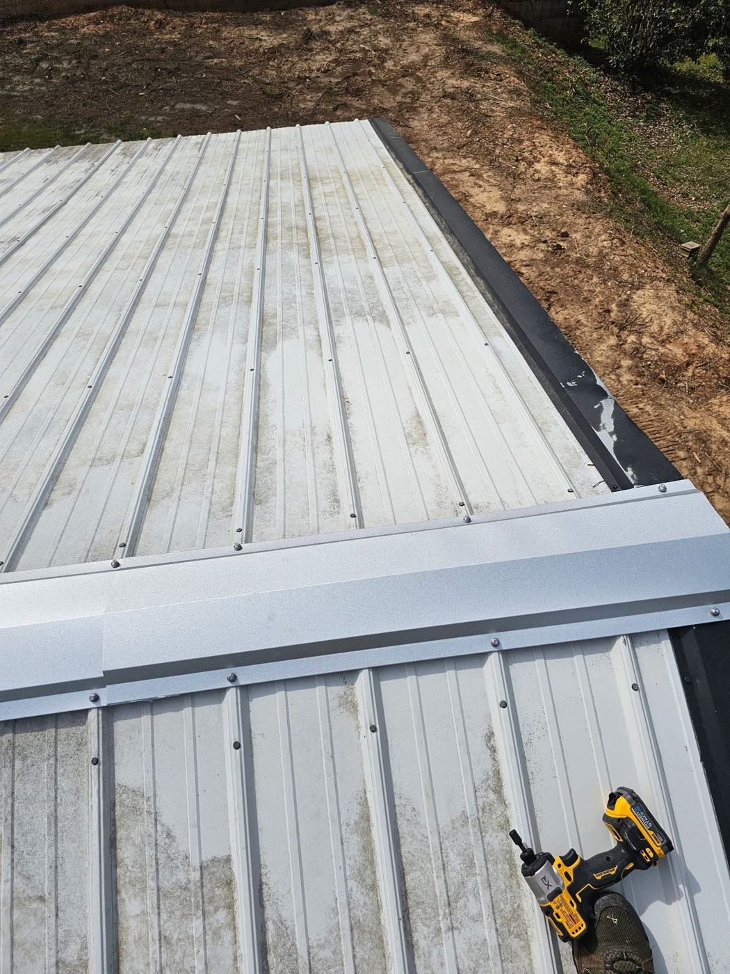 New ridge cap sealed and fastened on a metal roof — Precision Palmetto, Columbia SC