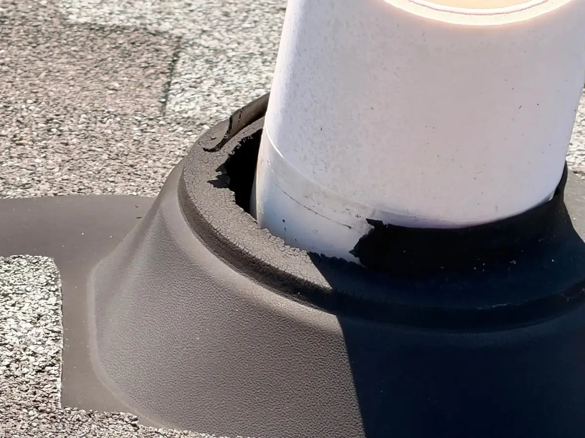 Cracked rubber collar on a failed plumbing vent pipe boot on an architectural shingle roof in Blythewood, SC — Precision Palmetto
