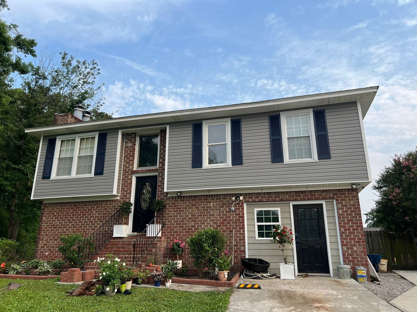 Full vinyl siding install over brick — front elevation — Precision Palmetto, Columbia SC